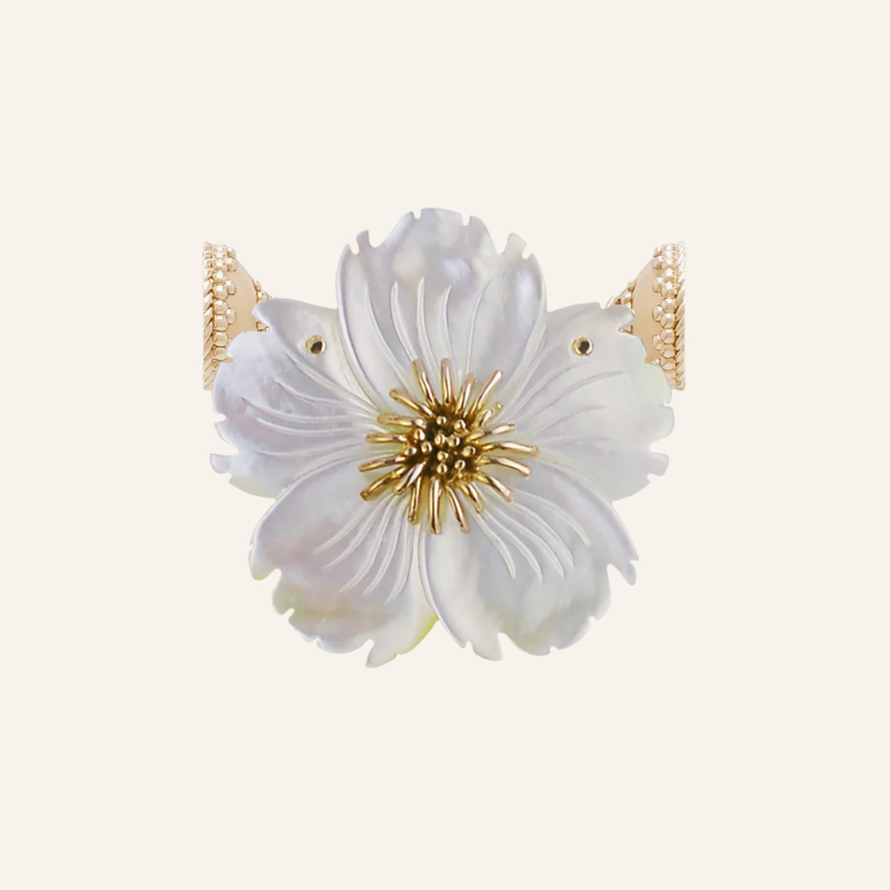 a white vase with a white flower in it 