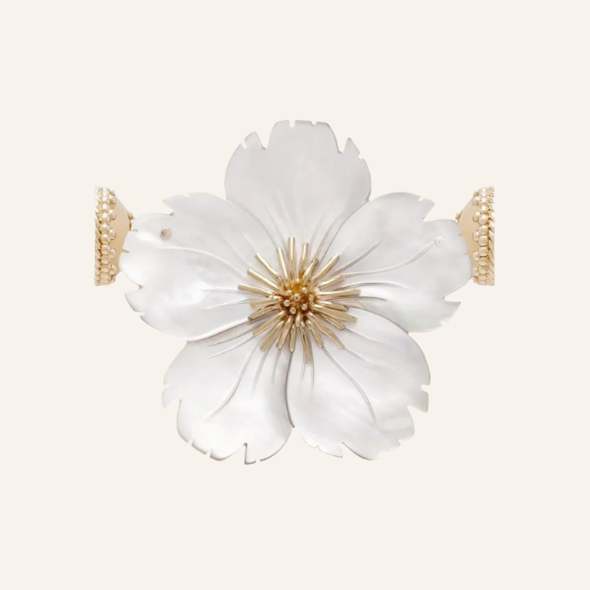 a white vase with a white flower in it 