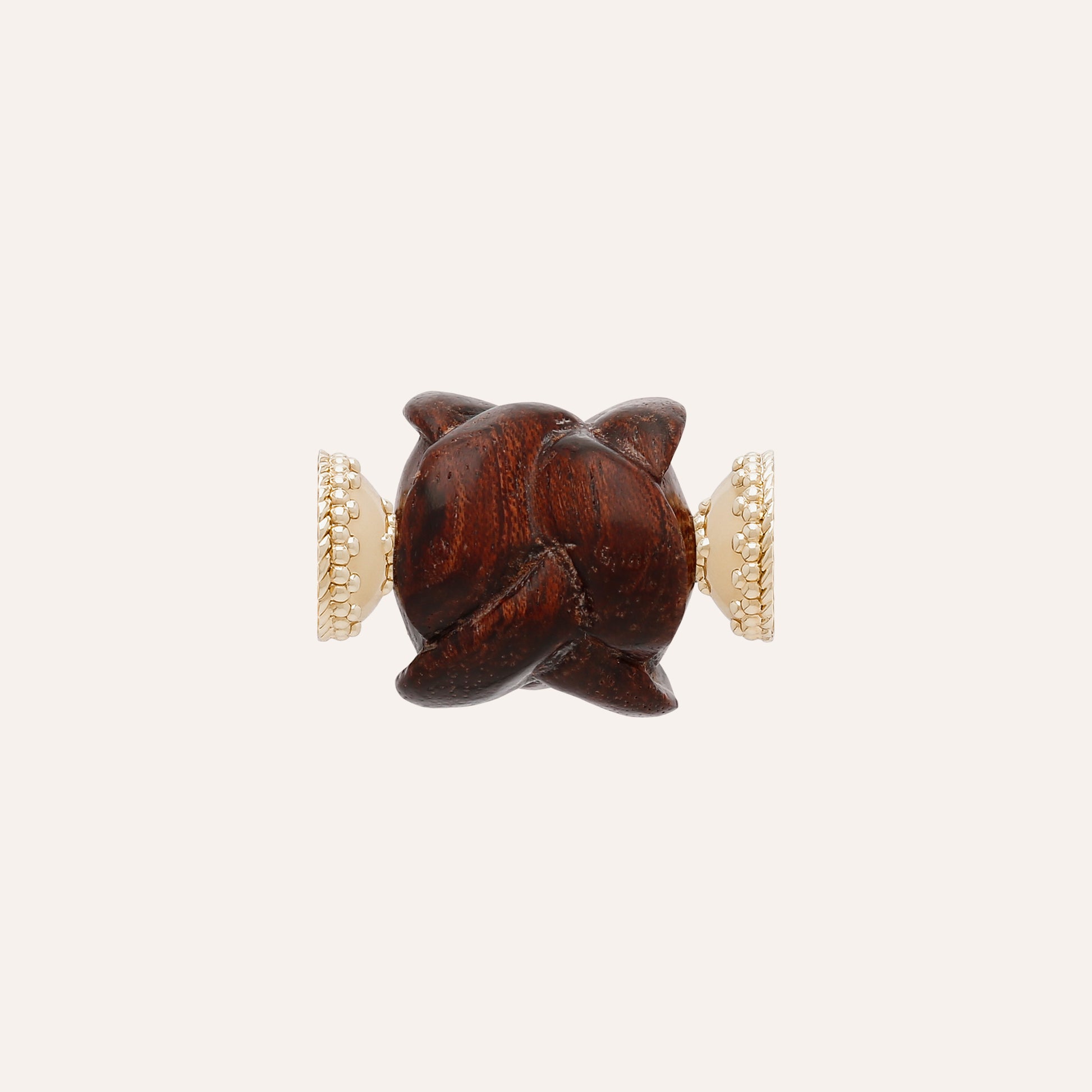 a brown teddy bear sitting on top of a bench 
