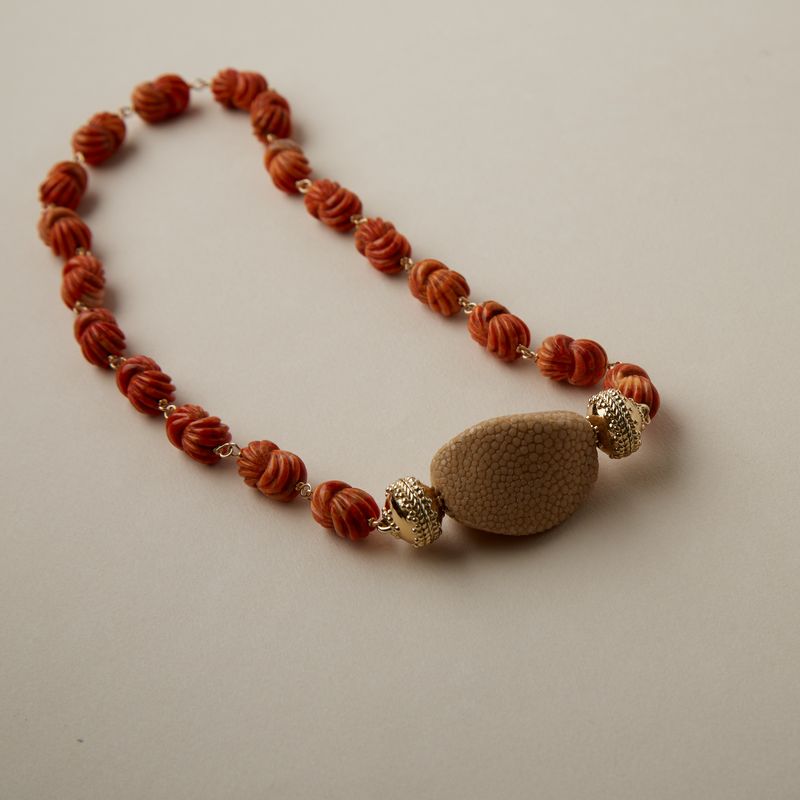 Caspian Apple Coral Carved Knot Necklace