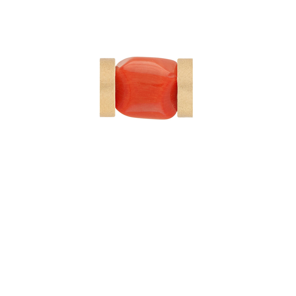 a red piece of luggage sitting on top of a table 